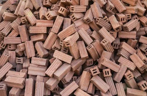 Stack of red clay bricks for construction site Stock Photos