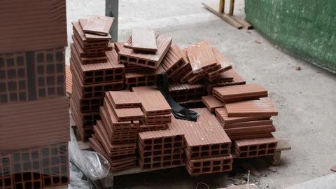 Stack of Red Clay Bricks at Construction Site Stock Photos