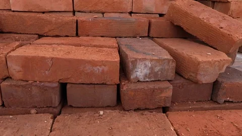 Stack of red clay bricks on the palette at warehouse close up Stock Footage 243835955
