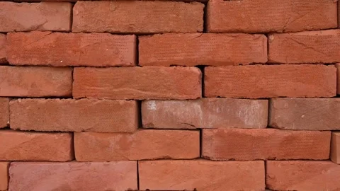 Stack of red clay bricks on the palette at warehouse close up Stock Footage 243835960