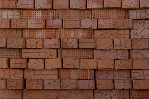 A stack of red clay bricks Stockfoto's