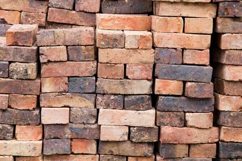A stack of red clay bricks Stock Photos