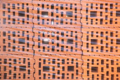 Stack of  Red clay Ceramic Bricks over Euro pallets, construction site, wra.. Stock Photos