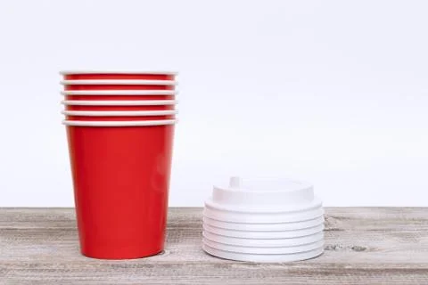 Stack of red disposable paper cups and covers Stock Photos