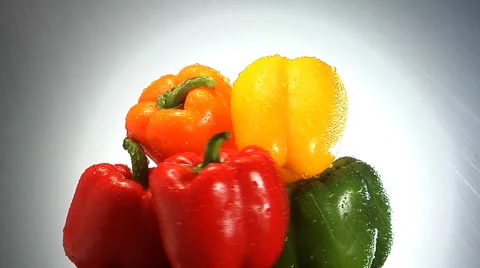 Stack of Red, Green, yellow and orange peppers rotate in frame Stock Footage 46371612