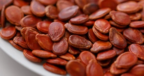Stack of red melon seed for lunar new year snack Stock Footage 106344440