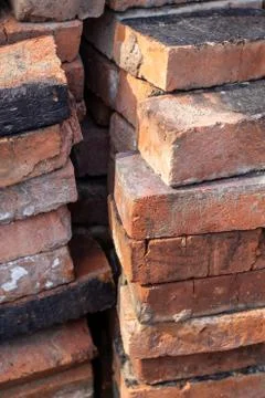 A stack of red not new fire bricks for laying a home stove Stock Photos