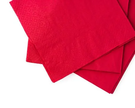 Stack of red paper napkins isolated on white background Stockfoto's