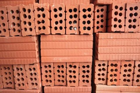 Stack of red perforated bricks Stock Photos