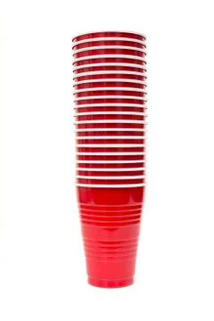 Stack of red plastic cups isolated against a white background 库存照片