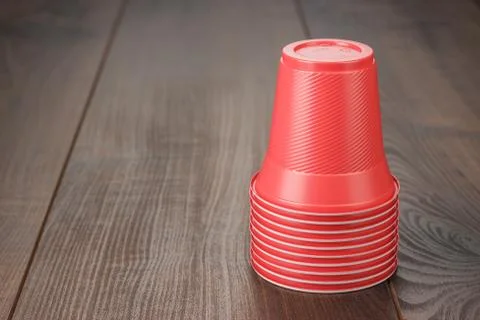 Stack of red plastic cups on the table 库存照片