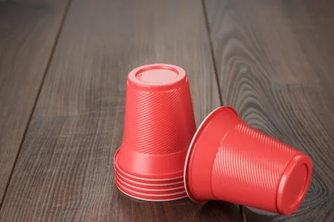 Stack of red plastic cups on the table Stock Photos
