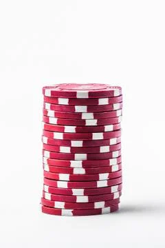 Stack of red poker chips on a white background Stock Photos