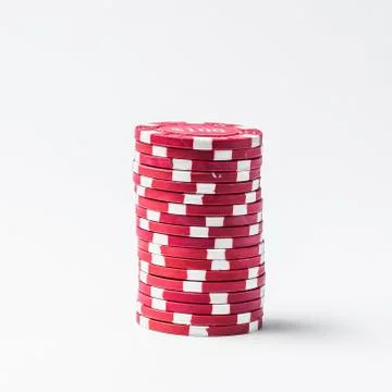 Stack of red poker chips on a white background Stock Photos
