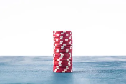 Stack of red poker chips on a white background Stock Photos