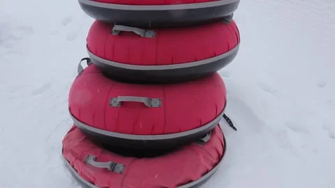 Stack of red snow tubes for sledding 库存影片 330715626