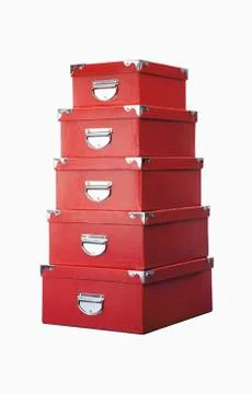 Stack of red storage boxes against white background Foto stock