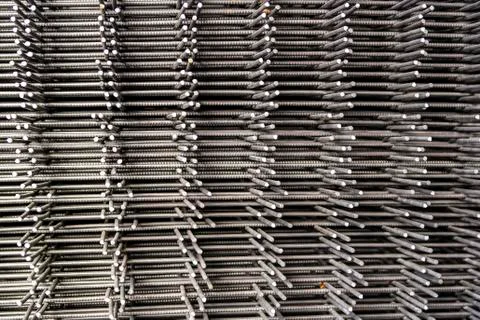 Stack of reinforcement mesh folded on each other view from the side Stock Photos