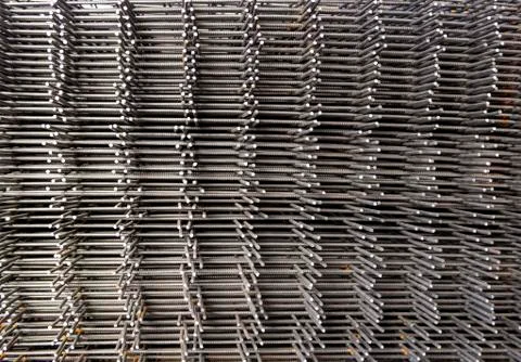 Stack of reinforcement mesh folded on each other view from the side Stock Photos
