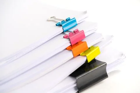 Stack of report paper files in business office clips. Stock Photos