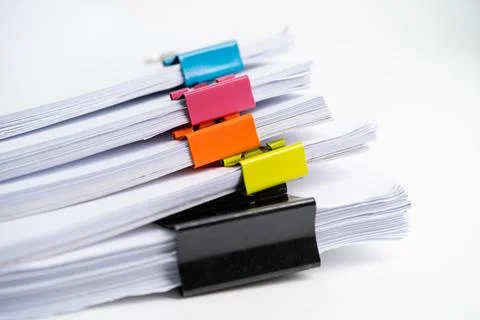 Stack of report paper files in business office clips. Stock Photos