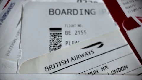 Stack of retro British Airways paper boarding passes and tickets, close-up Stock Footage 332393107