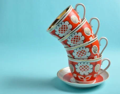 Stack of retro cups on a blue background.. Stock Photos