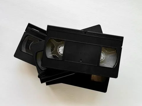 Stack of retro vhs tapes on light background showcasing vintage media technology Stock Photos
