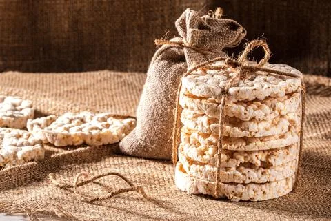 Stack of rice cakes on burlap napkin, close up Stock Photos