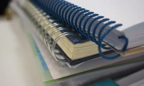 Stack of ring binder book  and document on desk Stock Photos