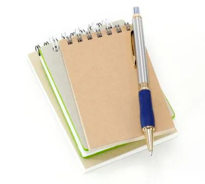 Stack of ring binder book or notebook and pen isolated on white background Stock Photos