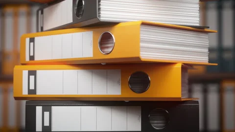 Stack of ring binders and folders with documents in a office or archive Stock Footage 339735994