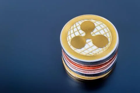 Stack of Ripple (XRP) cryptocurrency real coins Stock Photos