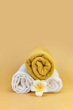 Stack of roll folded towels on a beige background, Stock Photos