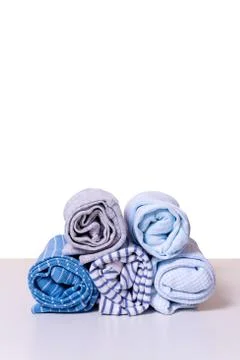 Stack rolled kid's clothes in blue colors. 스톡 사진