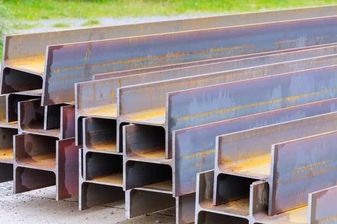 The stack of rolled metal is at the factory, overlooking the steel profile Stock Photos
