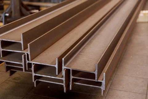 The stack of rolled metal is at the factory, overlooking the steel profile 스톡 사진