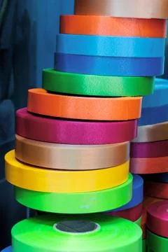 A stack of rolls of multi-colored ribbon Stock Photos