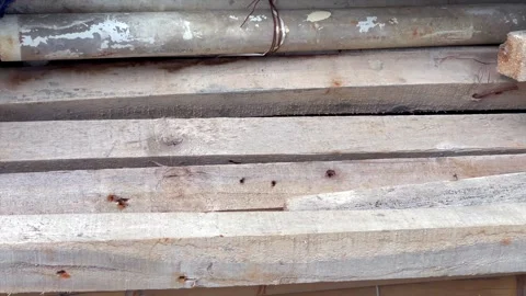 Stack of rough wooden beams on a construction site Vídeo Stock 339537434