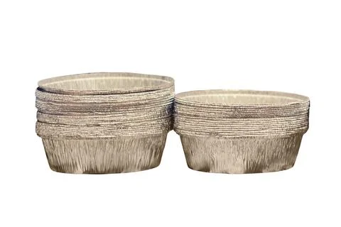 Stack of round aluminum foil baking cups for cupcakes and muffins. Disposable Stock Photos
