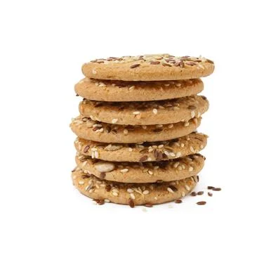 Stack of round cereal crackers with flax, sunflower and sesame seeds isolat.. Stock Photos