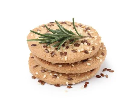 Stack of round cereal crackers with flax, sunflower, sesame seeds and rosem.. Stock Photos