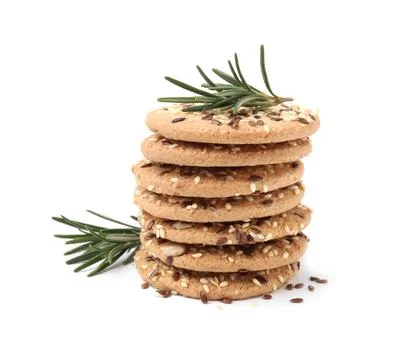 Stack of round cereal crackers with flax, sunflower, sesame seeds and rosem.. Fotos Stock