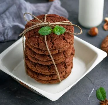 Stack of round chocolate biscuits tied with a rope Stock Photos