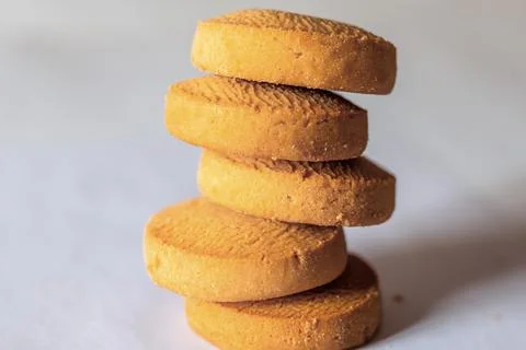 A stack of round cookies on a white background closeup Stock Photos