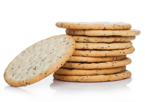 Stack of round organic crispy wheat and five grain salty crackers with seeds Foto stock