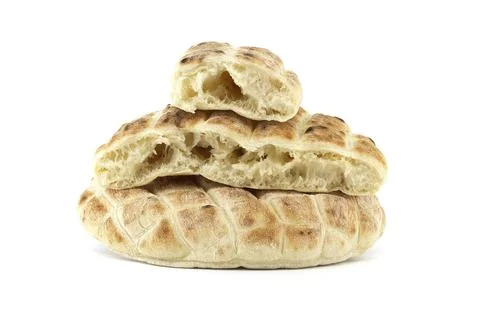 Stack of round pita flat-breads isolated on a white background, pita bread has a Stock Photos