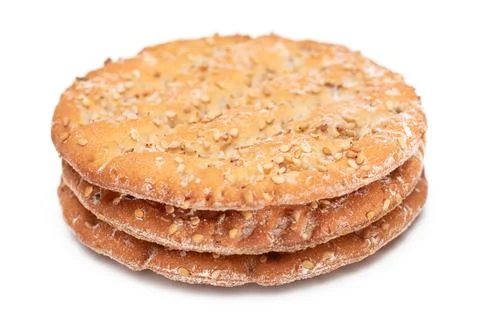 A Stack of Round Salt Crackers with Sesame Isolated on White Background Fotos Stock