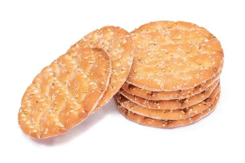 A Stack of Round Salt Crackers with Sesame Isolated on White Background Foto stock