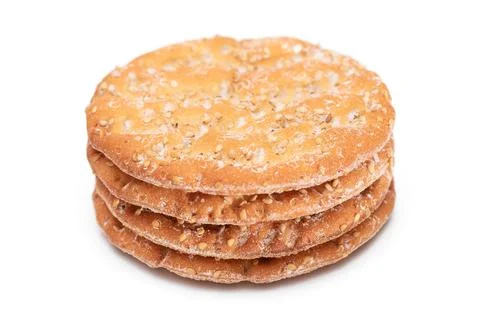 A Stack of Round Salt Crackers with Sesame Isolated on White Background Fotos Stock